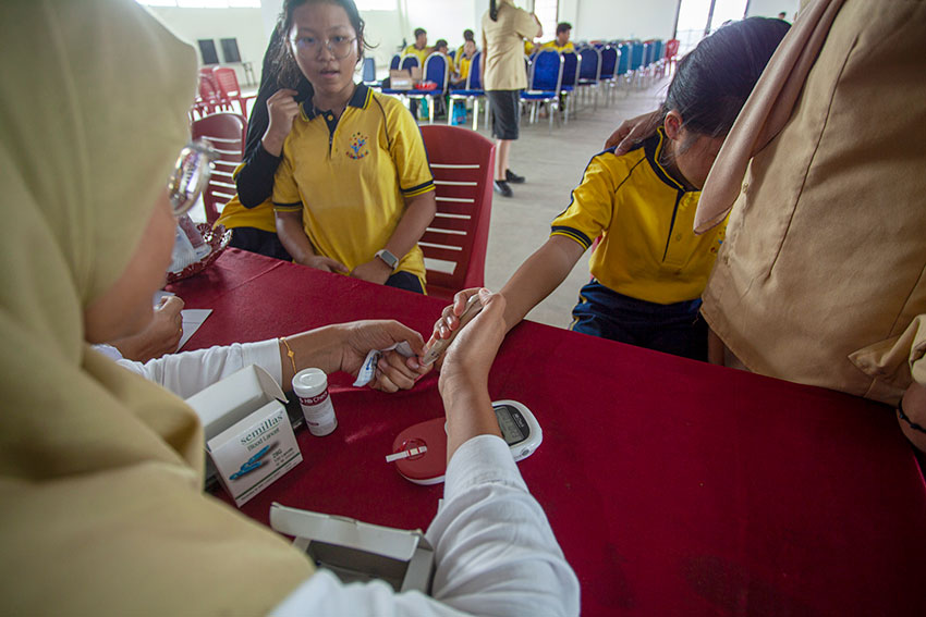 Layanan Cek Kesehatan Gratis (CKG), di Sekolah Kaliban, Batam, Kepulauan Riau, Rabu (30/7). [astakom/str-Andaru AK]